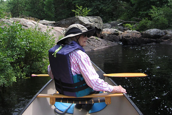 A senior paddling bow on Cartier Creek in Petawawa Research Forest