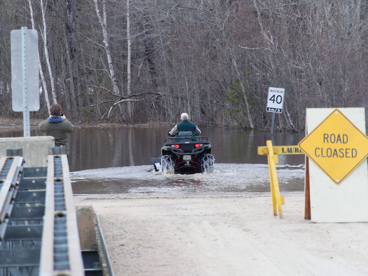 The Chalk River is flowing over Forestry Road  doesnt stop the ATVs