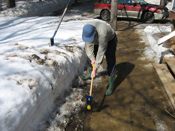 clearing ice from and draining the front walk