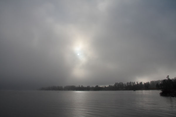 misty sun rising over Lamure Beach on the Ottawa River at Deep River