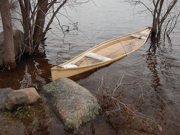 partially submerged canoe along the Deep River Waterfront