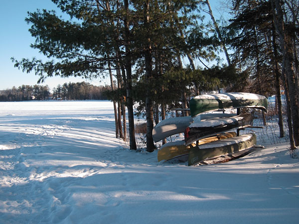 canoes in snow along the Deep River Waterfront