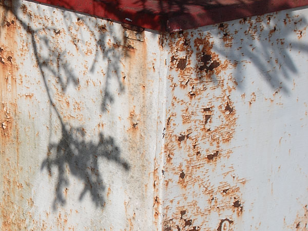 shadows on garbage container