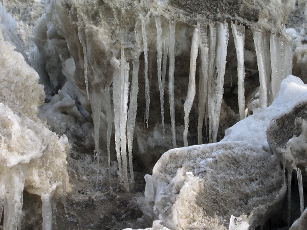 Sun sculpted piles of snow removed from the streets of Deep River
