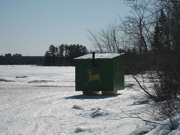 ice fishing shack on the shore of the Ottawa River at Deep River